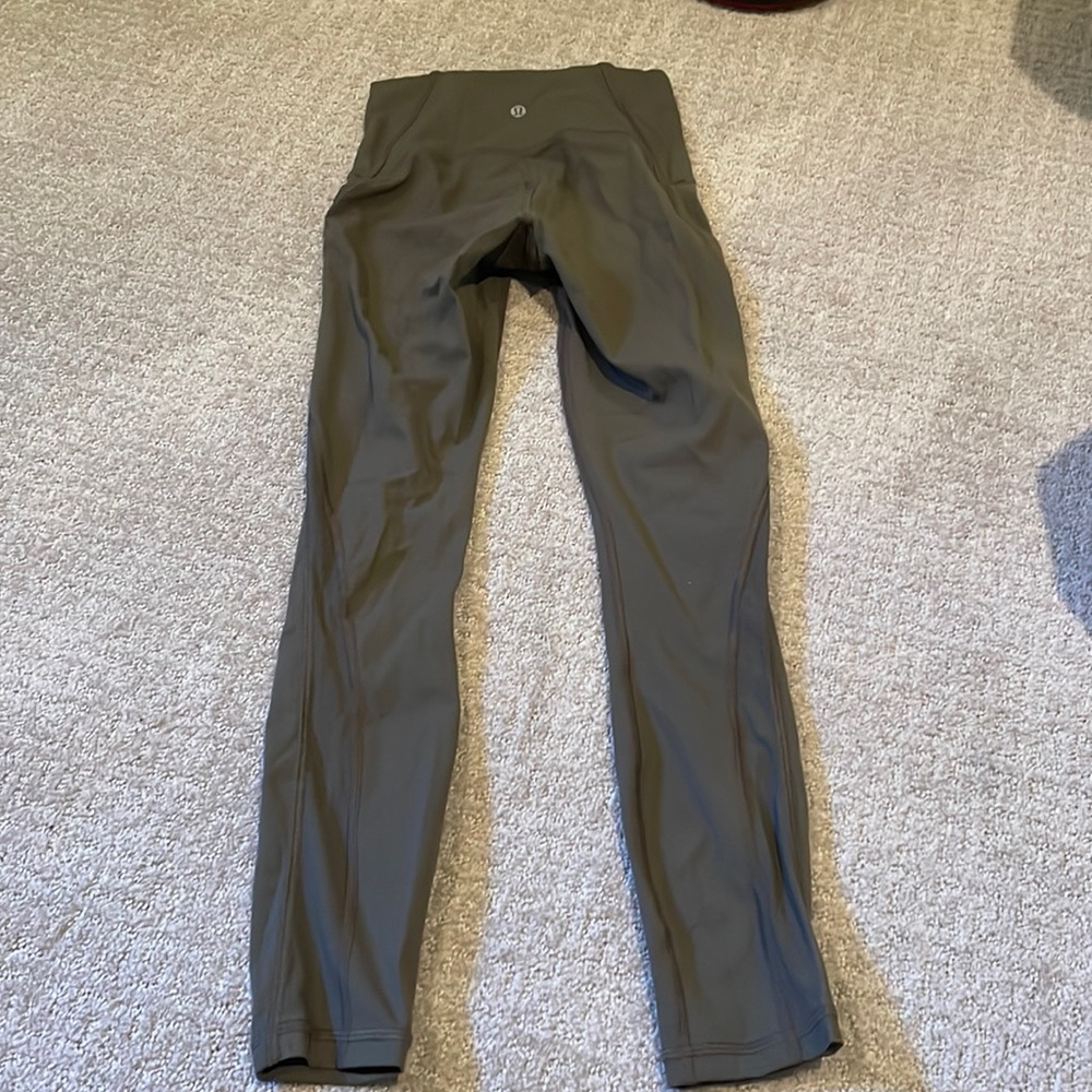 Olive Lululemon leggings with mesh on side
